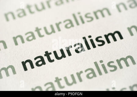 word naturalism printed on white paper macro Stock Photo