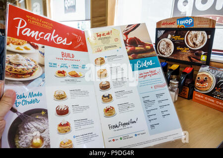 Gainesville Florida,IHOP,International House Pancakes,restaurant restaurants food dining cafe cafes,interior inside,photo menu,pancakes,FL171028145 Stock Photo
