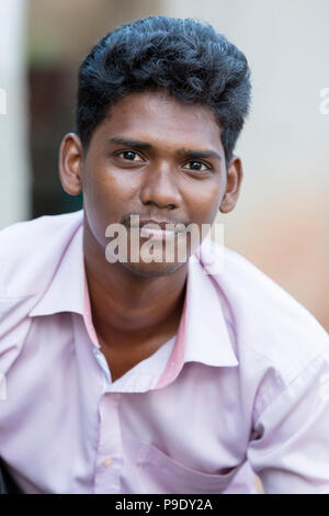 Premium Photo | Portrait of beautiful cheerful indian man with flying curly  hair smiling laughing on dark background