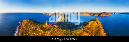 Barrenjoye head at the tip of Palm beach and Broken bay on Sydney northern beaches. Above elevated Lighthouse in wide aerial panorama. Stock Photo