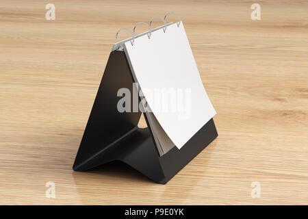 Blank landscape table top flip chart easel binder or calendar mockup standing on wooden background isolated with clipping path. 3d illustration Stock Photo