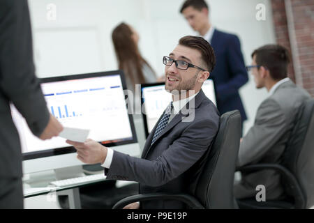 businessman working on a computer on business reports Stock Photo