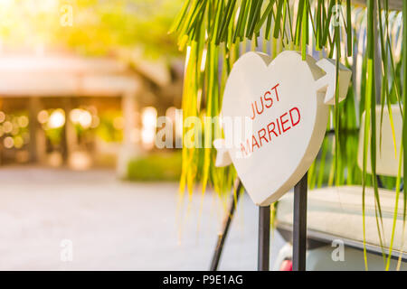 Just married sign on wooden table, tropical wedding background. Happy image of wedding concept background Stock Photo