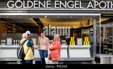 Basel, seniors chatting in front of Goldene Engel pharmacy, Switzerland, Europe, Stock Photo