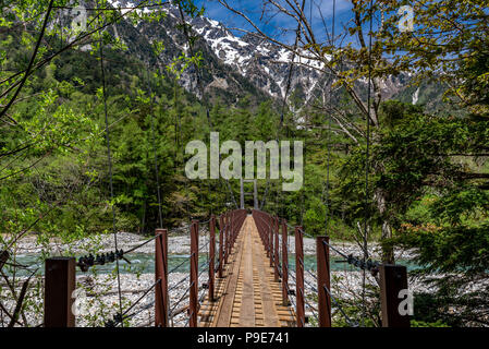 Bridge over stream in kamikochi, Japan Stock Photo