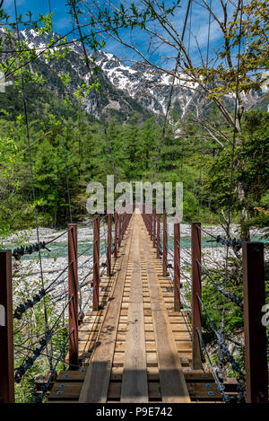 Bridge over stream in kamikochi, Japan Stock Photo