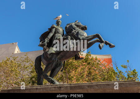 Simon Bolivar bronze statue with a western gull (Larus occidentalis) perched on the General Bolivar's head, San Francisco, California, United States. Stock Photo
