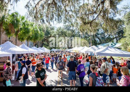 Florida,Micanopy,Fall Harvest Festival,annual small town community booths stalls vendors buying selling,crowd,strolling,families,FL171028211 Stock Photo