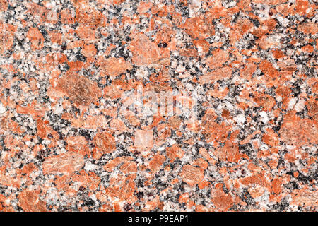 rough orange black granite stone rock surface texture Stock Photo