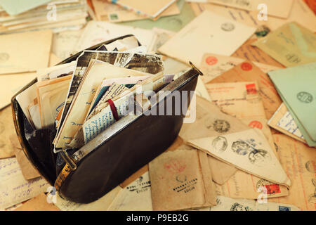 Family archive in the vintage bag and postal letters of World War2.  Envelopes are stamped: 'Viewed by military censorship' Stock Photo