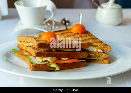 two delicious Panini sandwich on a white plate. tasty breakfast Stock Photo