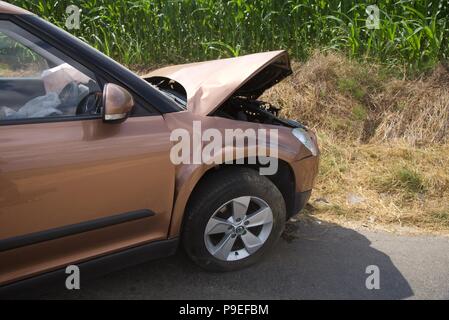 Car crash: the aftermath of a head-on collision (no injuries) on a rural French road with a British owned car and a French courier van (removed) Stock Photo