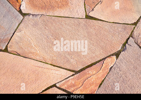 Beige stone blocks texture with copy space. Paved road or stone wall close up Stock Photo