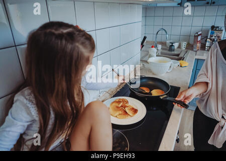 happy family cook together in the kitchen Stock Photo