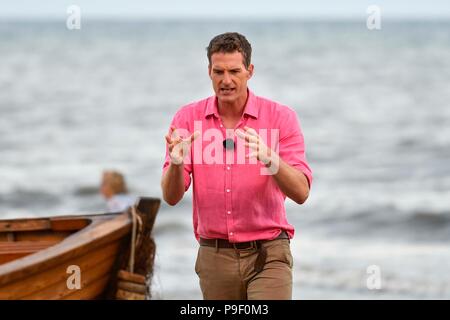 Charmouth, Dorset, UK.  17th July 2018.  Dan Snow during the filming of BBC4's Beach Live, Jurassic Coast Revealed at Charmouth beach in Dorset with presenters historian Dan Snow and natural history experts Lucy Cooke and Niall Strawson.  This was the first one hour live programme of three over 3 evenings which finishes on the 19th July.  Picture Credit: Graham Hunt/Alamy Live News Stock Photo