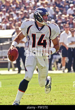 Nov 05, 2001; Oakland, CA, USA; Denver Broncos quarterback Brian Griese,  #14, is helped up by teammates Dan Neil, #62, and Matt Lepsis, #78, after  being sacked by Oakland Raiders Grady Jackson, #