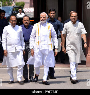 (180718) -- NEW DELHI, July 18, 2018 (Xinhua) -- Indian Prime Minister Narendra Modi (C) arrives on the opening day of the monsoon session of parliament in New Delhi, India, July 18, 2018. The monsoon session of parliament began on Wednesday and continue until August 10. (Xinhua/Partha Sarkar) (rh) Stock Photo