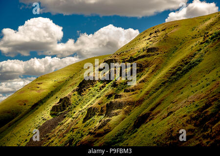 Traveling through Cottonwood Canyon (Oregon), picturesque cotton ball clouds made for some wonderful shadows across the landscape. I was fortunate to  Stock Photo