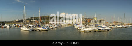 Panoramic view of boats in the marina on the River Tawe in Swansea. T SA1 office development - is a major regeneration project - s in the background. Stock Photo