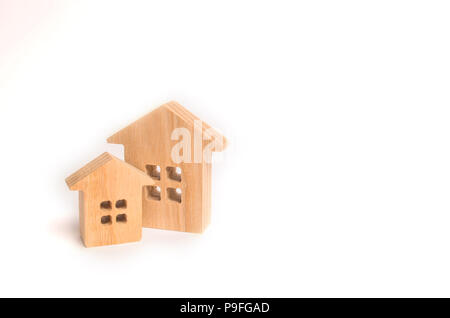 Two wooden houses on a white background. Concept of real estate, buying and selling. Rent. Statistical data. Minimalism. Investments, insurance and co Stock Photo