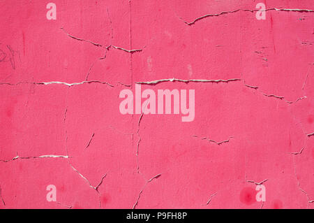 Old dirty stained grunge weathered red painted plastered house wall surface closeup as background Stock Photo