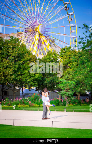 A beautiful Asian couple spend time in the Tuileries Garden in Paris, France Stock Photo