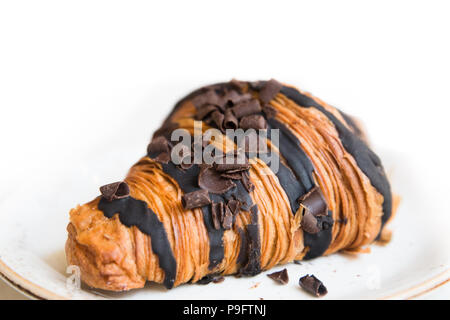 Gourmet dessert chocolate croissant with icing Stock Photo