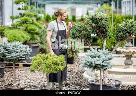 Gardener working in the garden Stock Photo