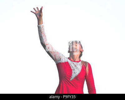 Bespectacled Blonde Teen Majorette Girl in Red Dress Looking Up Stock Photo