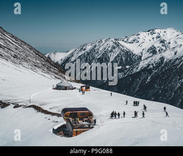 Ski lift in Almaty mountains. Shymbulak Ski Resort Hotel in Almaty city, Kazakhstan, Central Asia. Stock Photo