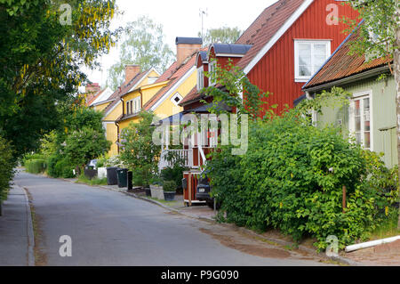 Stockholm, Sweden - June 9, 2016: Summer green view of Swedish middle class cottages in suburban area of Linde. Stock Photo
