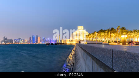 The museum is built on an island off an artificial projecting peninsula near the traditional dhow  harbor in Doha Qatar. Stock Photo