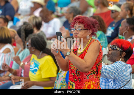 Detroit, Michigan - A woman uses her cell phone to film the action during Senior Friendship Day, an event that brought several thousand senior citizen Stock Photo