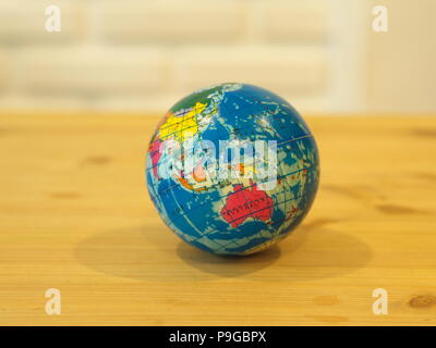 Close Up Mini Globe with Wooden Table Background Stock Photo