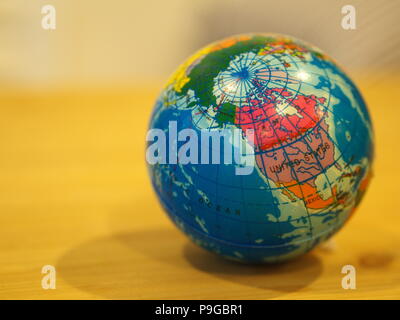 Close Up Mini Globe with Wooden Table Background Stock Photo