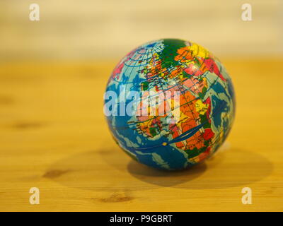 Close Up Mini Globe with Wooden Table Background Stock Photo