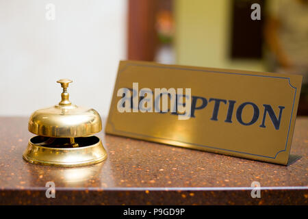 Golden bell in hotel Stock Photo