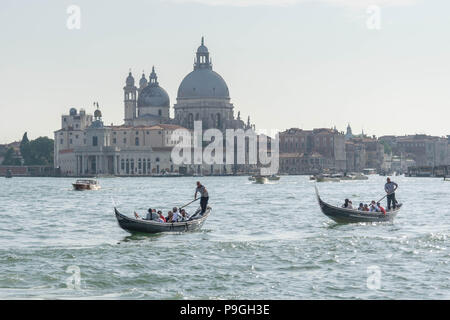 Europe, Italy, Veneto, Venice. People sightseeing Venice (Bacino San Marco), swimming with gondola towards Castello district. Stock Photo
