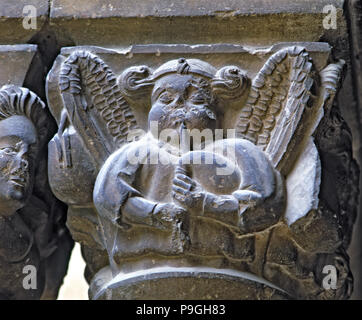 Capital of one of the Gothic galleries of the cloister built between (1387 - 1401) representing a… Stock Photo