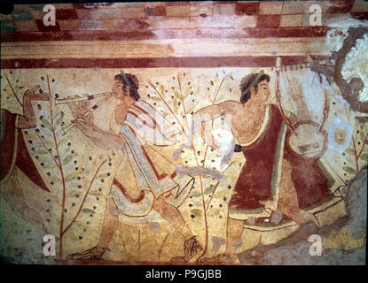 Burial chamber of the necropolis of Tarquinia, mural painting with the representation of two musi… Stock Photo