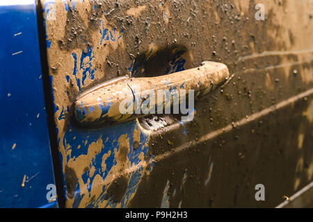 Fragment of dirty car in rural areas close-up Stock Photo