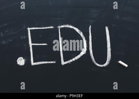 Edu internet domain for educational institutions, conceptual image of text written in chalk on school blackboard Stock Photo