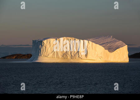 Large Iceberg in evening light, Scoresby Sound, Eastern Greenland Stock Photo