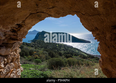 Old Navarino Castle looking over the Pylos bay in Gialova, Peloponnese, Greece, with Sphacteria island framed in arch. Stock Photo