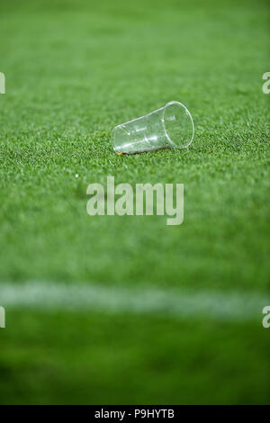 Plastic trash can on the turf on a soccer field Stock Photo