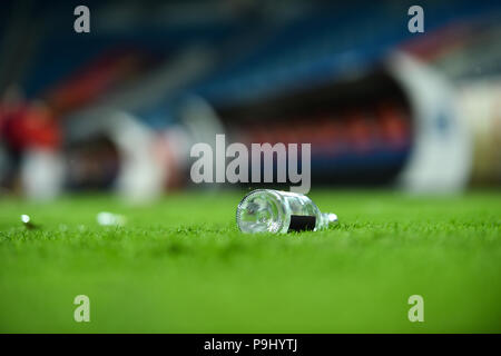 Plastic trash can on the turf on a soccer field Stock Photo