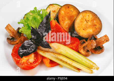 Vegetables and mushroom stir fry on white plate Stock Photo