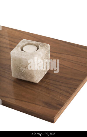Candlestick made of natural salt on varnished coating, reflection of objects. Stock Photo