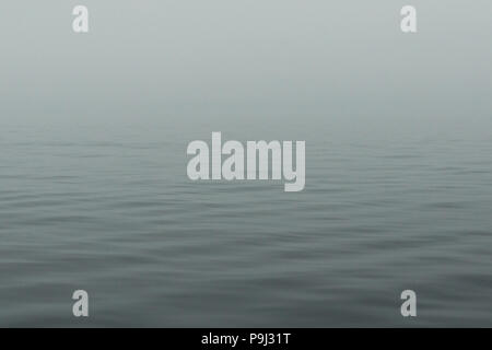 Calm Lake Huron water with ripples in the early morning background wallpaper Stock Photo