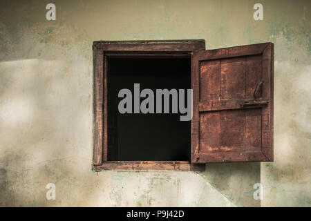 Open old window on the old house. Stock Photo
